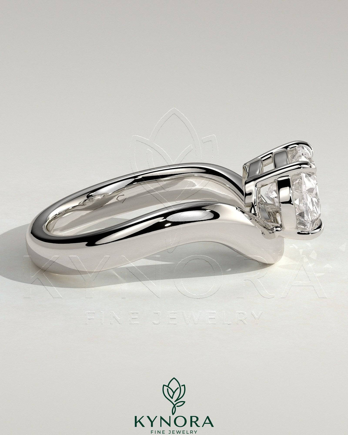 Kynora CJ 2ct oval east-west claw solitaire engagement ring with wave band in polished gold setting.