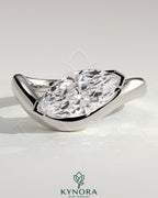 Kynora CJ 2ct marquise east-west claw solitaire engagement ring with wave band, showcasing a sparkling marquise diamond and elegant band design.