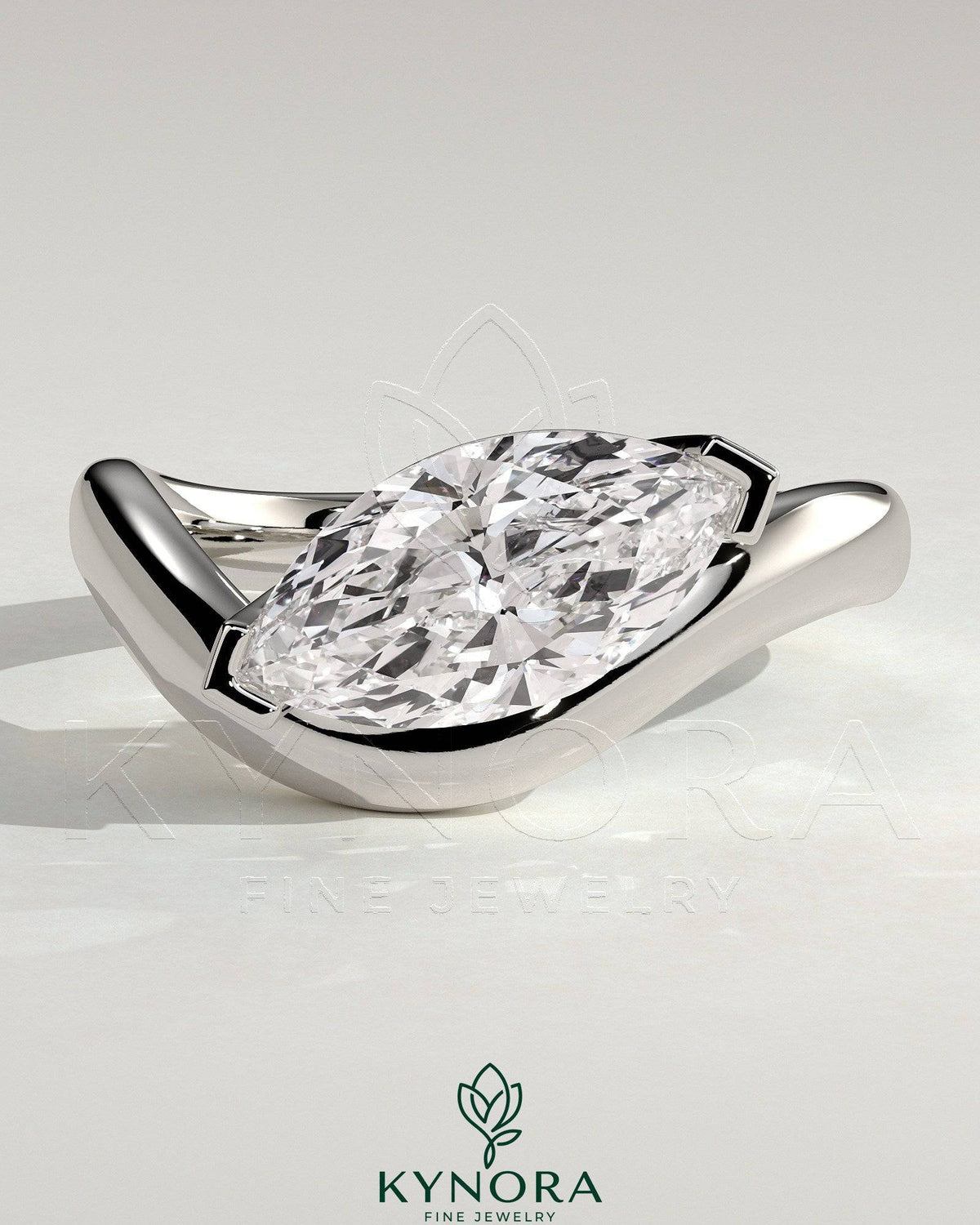 Kynora CJ 2ct marquise east-west claw solitaire engagement ring with wave band, showcasing a sparkling marquise diamond and elegant band design.