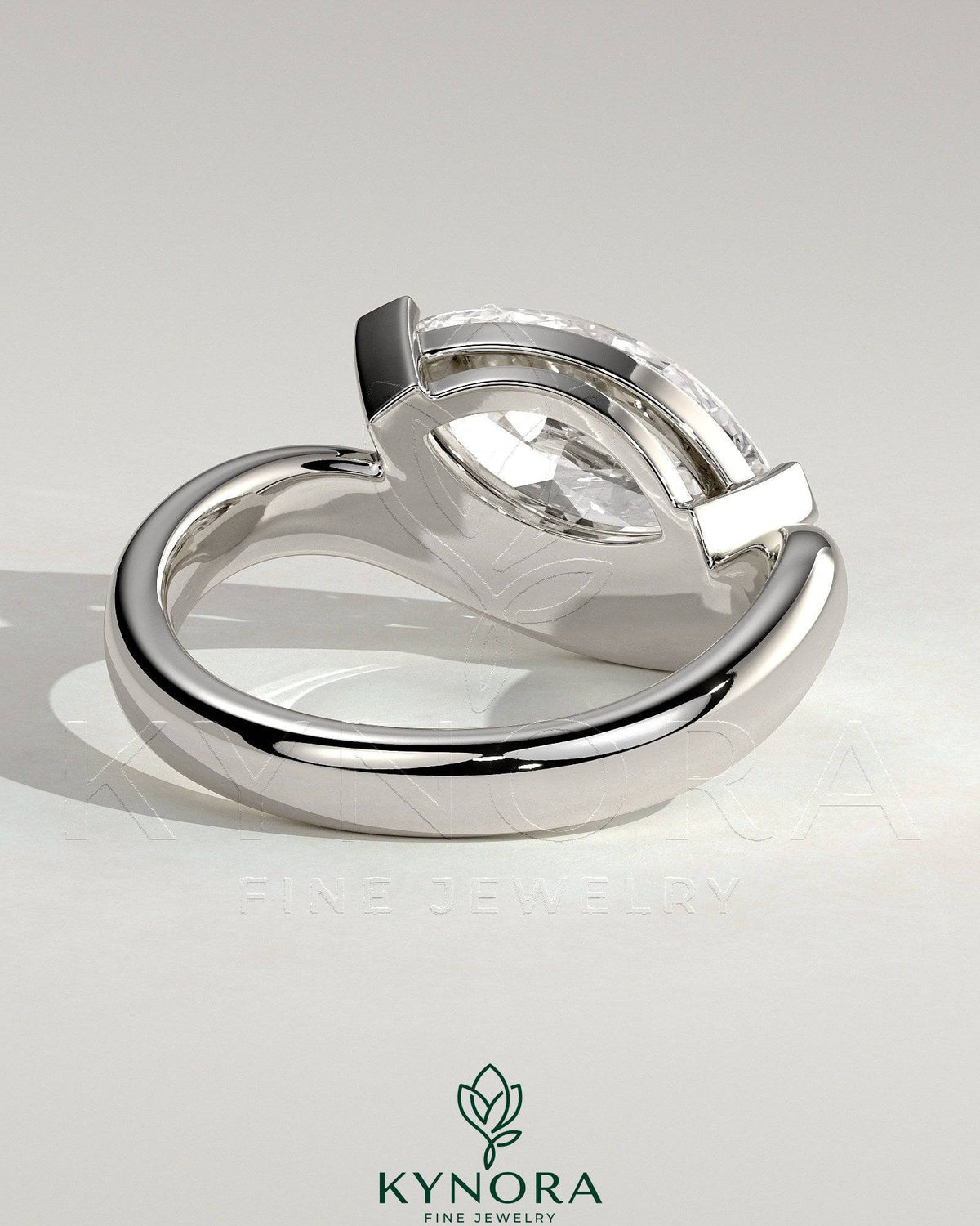 Kynora CJ 2ct marquise east-west claw solitaire engagement ring with wave band showcasing sparkling diamond design.
