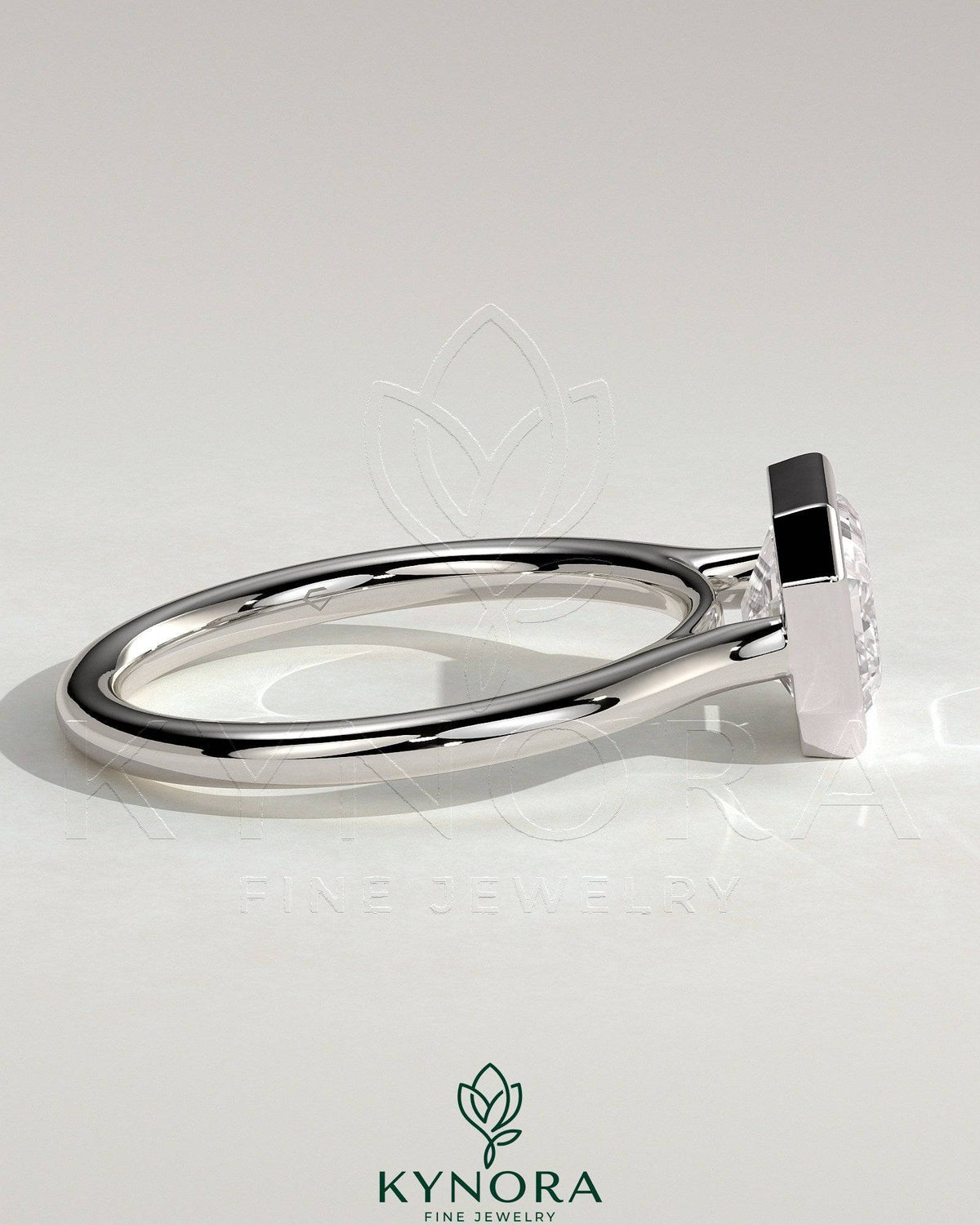 Kynora CJ statement 2ct emerald east-west bezel solitaire engagement ring with open cathedral high setting, showcasing intricate design.