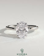 Kynora CJ Classic 2ct oval claw solitaire engagement ring featuring a central oval diamond and sleek band design.