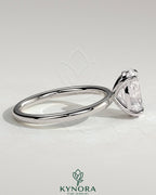 Kynora CJ Classic 2ct oval claw solitaire engagement ring featuring a shimmering oval diamond and elegant band.