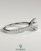 Kynora CJ 2ct round diamond solitaire engagement ring with crown gallery and pave band showcasing elegant craftsmanship.