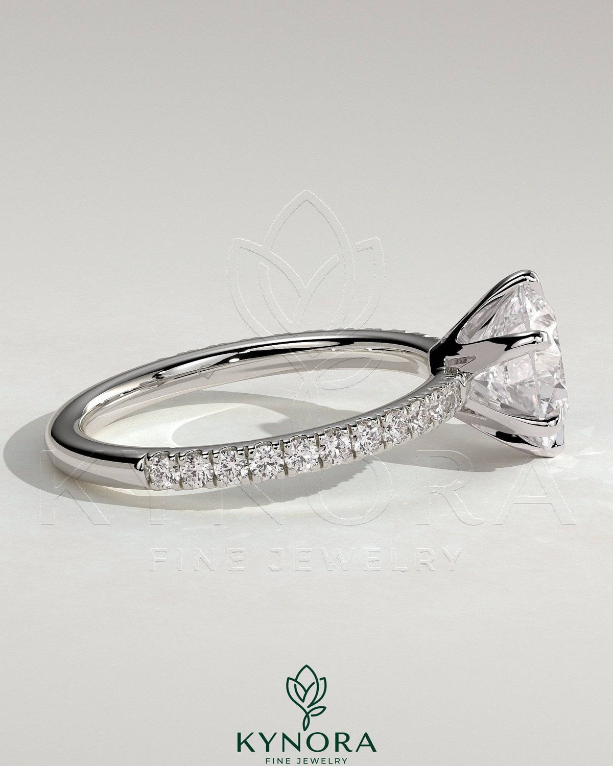Kynora CJ 2ct round diamond solitaire engagement ring with crown gallery and pave band showcasing elegant craftsmanship.