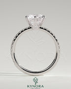 Kynora CJ 2ct round claw solitaire engagement ring with crown gallery and pave band, showcasing elegant craftsmanship.
