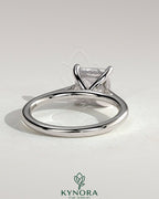 Kynora CJ 2ct princess cut solitaire engagement ring with hidden halo and cathedral high setting, showcasing elegant jewelry craftsmanship.