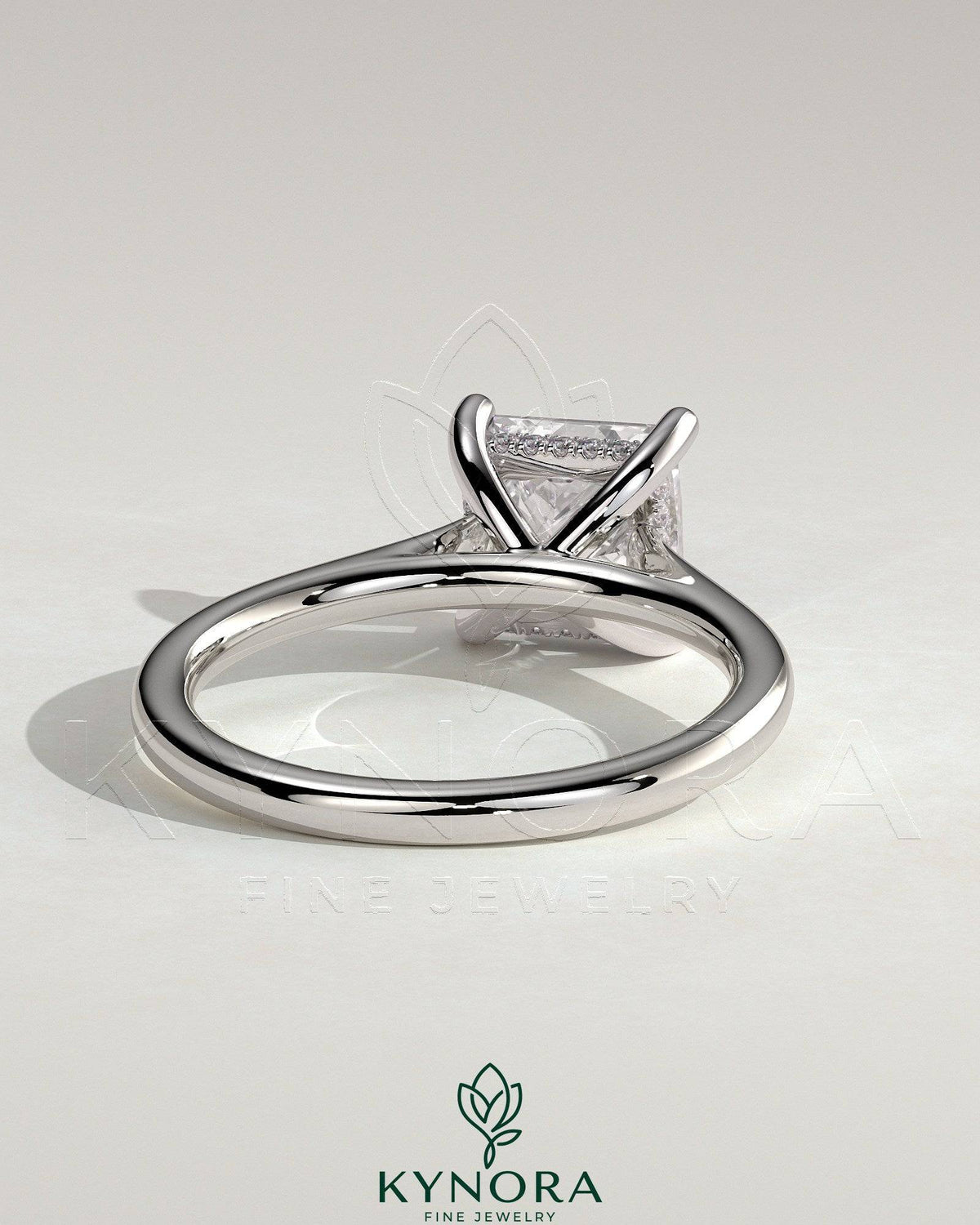 Kynora CJ 2ct princess cut solitaire engagement ring with hidden halo and cathedral high setting, showcasing elegant jewelry craftsmanship.