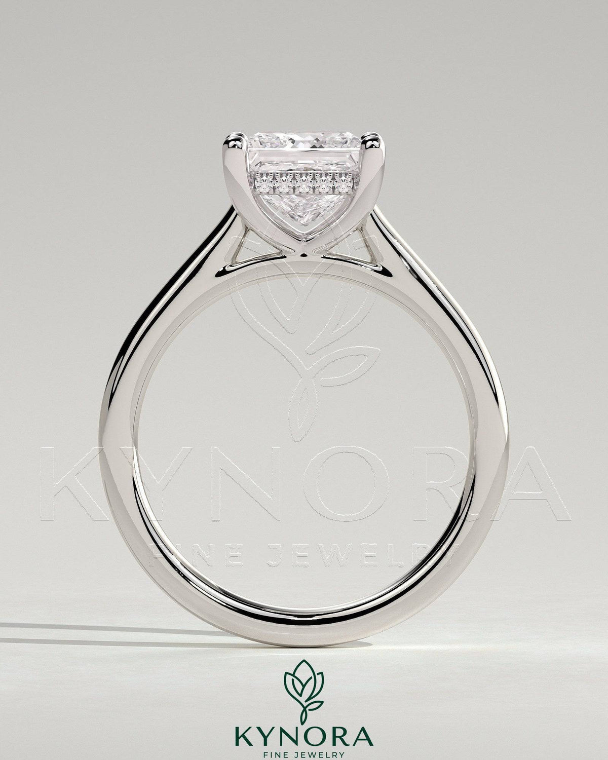 Kynora CJ 2ct princess cut solitaire engagement ring with hidden halo and cathedral high setting, showcasing elegant jewelry craftsmanship.