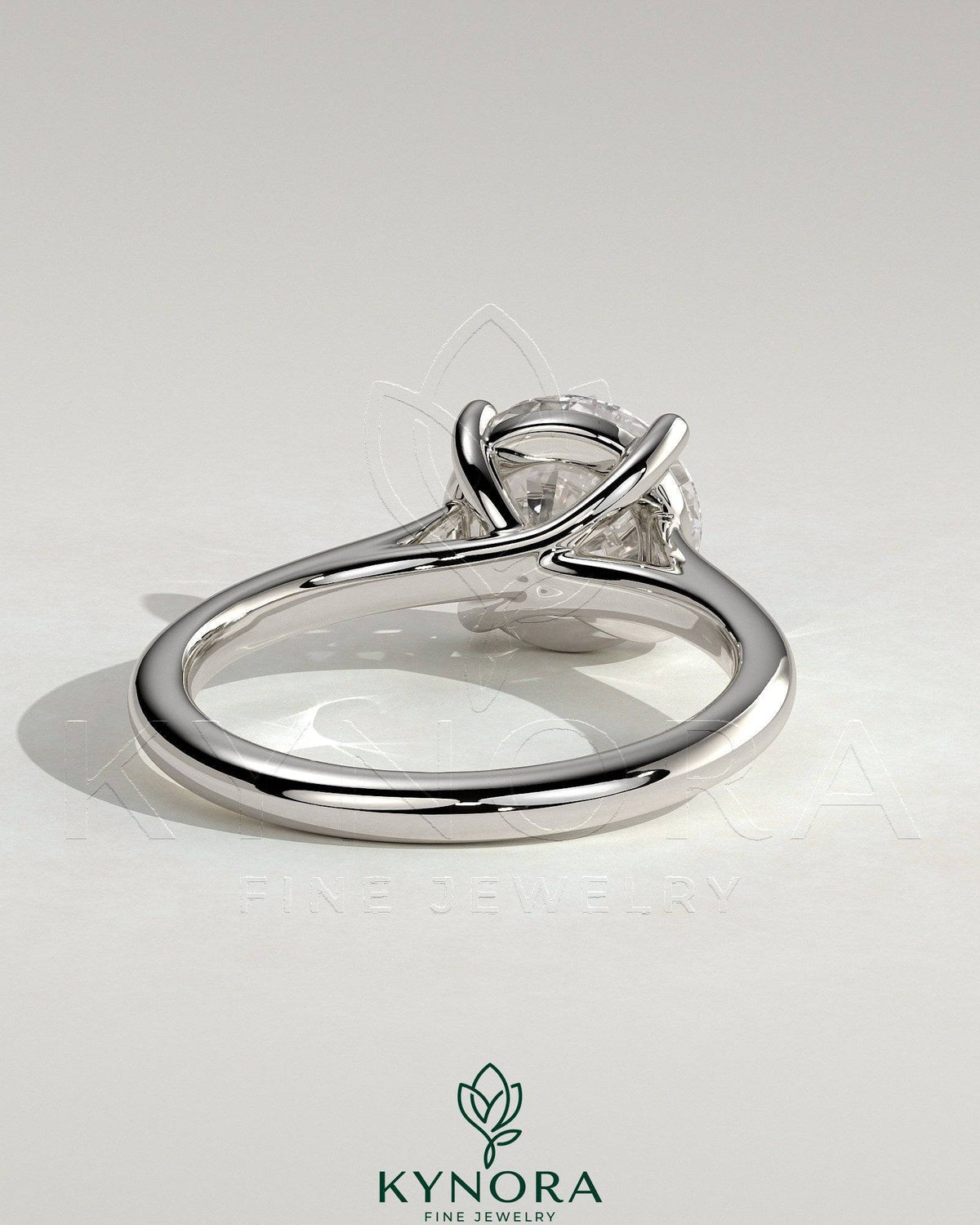 Kynora CJ 2ct round diamond solitaire engagement ring with trellis gallery and cathedral low setting, showcasing elegant craftsmanship.