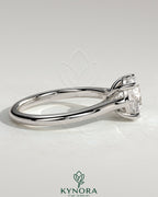 Kynora CJ 2ct round claw solitaire engagement ring with trellis gallery and cathedral low setting, showcasing elegant jewelry craftsmanship.