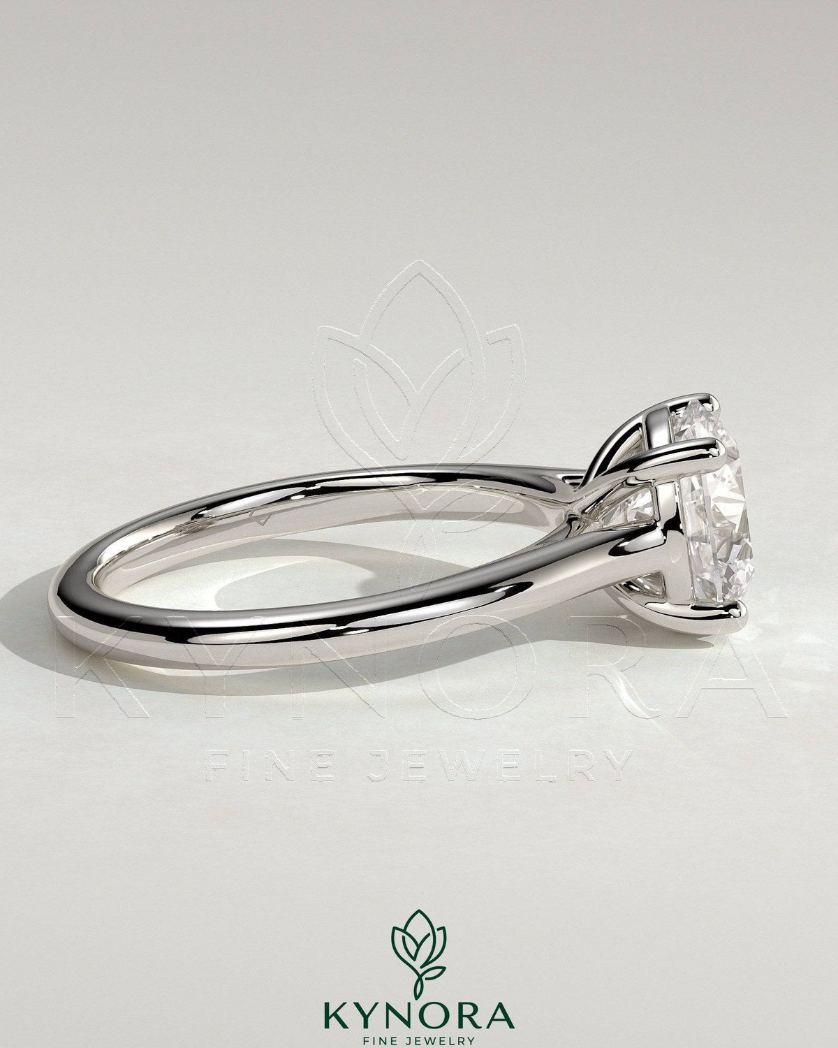 Kynora CJ 2ct round claw solitaire engagement ring with trellis gallery and cathedral low setting, showcasing elegant jewelry craftsmanship.