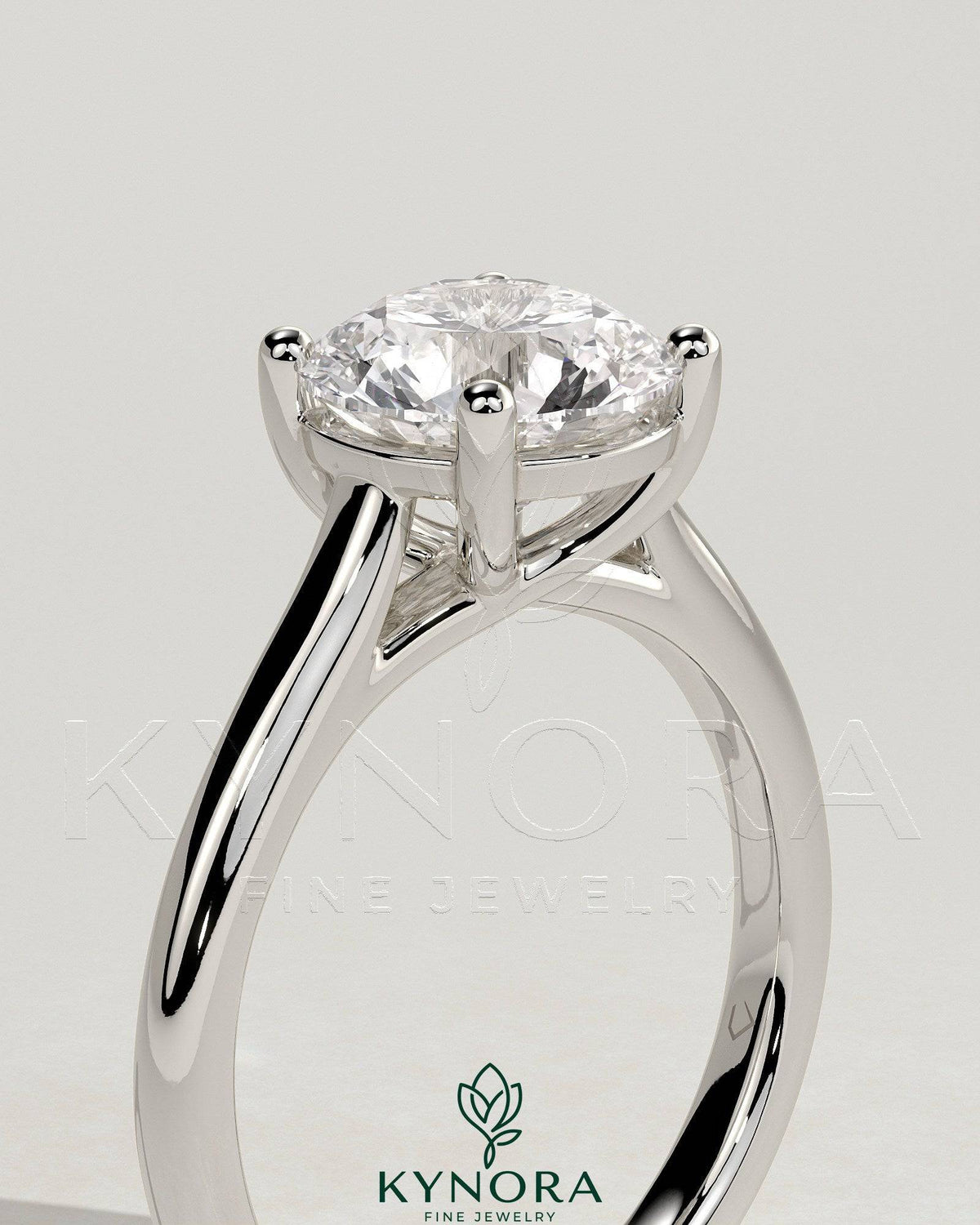 Kynora CJ 2ct round diamond solitaire engagement ring with trellis gallery and cathedral low setting, showcasing elegant jewelry craftsmanship.