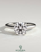 Kynora CJ 2ct round diamond solitaire engagement ring with trellis gallery and cathedral low setting, elegant and detailed design