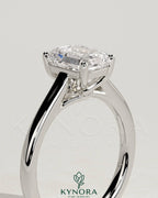 Kynora CJ 2ct emerald claw solitaire engagement ring with spiral gallery and cathedral low setting, elegant and detailed design