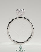 Kynora CJ classic 2ct oval claw solitaire engagement ring featuring a sparkling oval diamond on a sleek band.