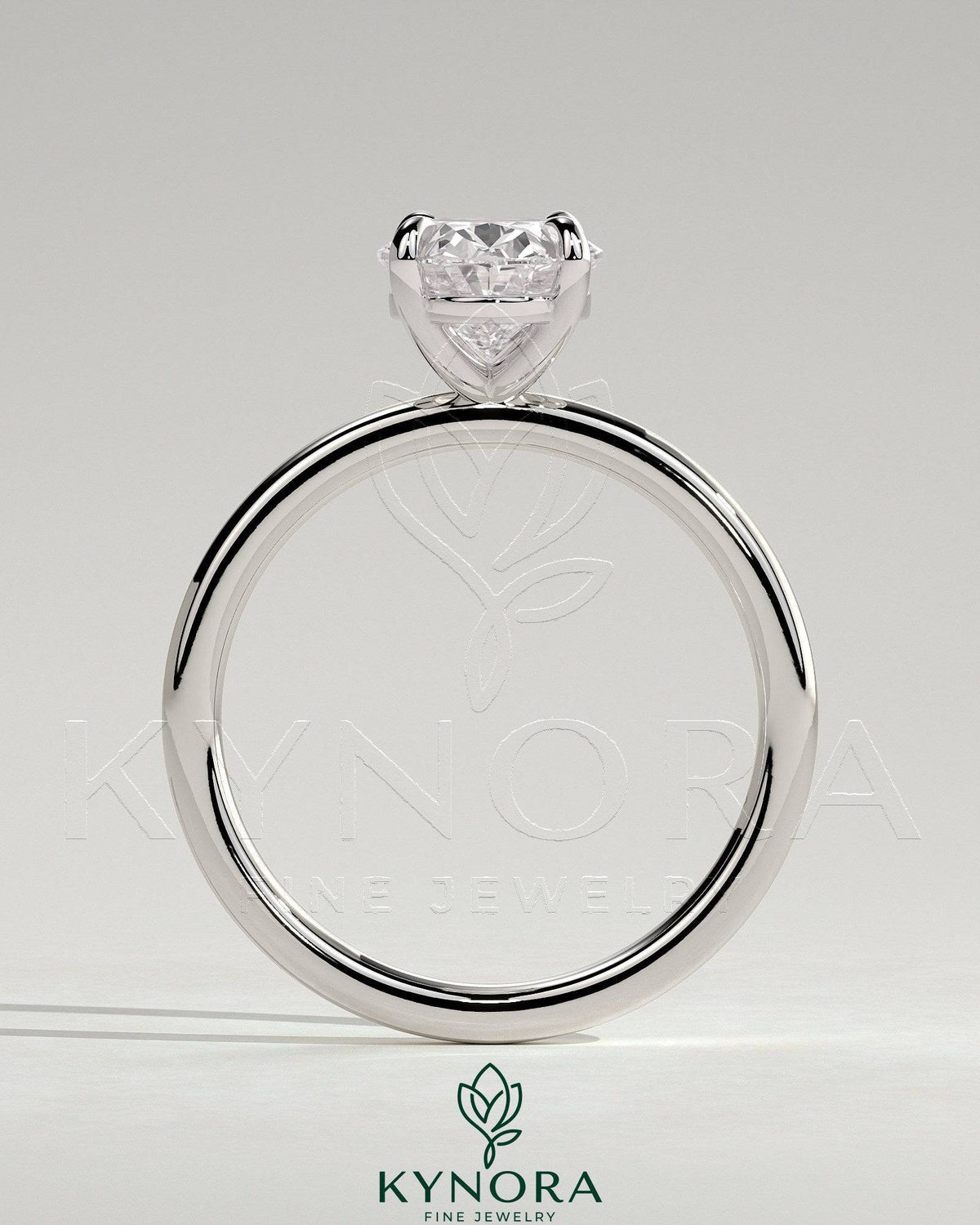 Kynora CJ classic 2ct oval claw solitaire engagement ring featuring a sparkling oval diamond on a sleek band.