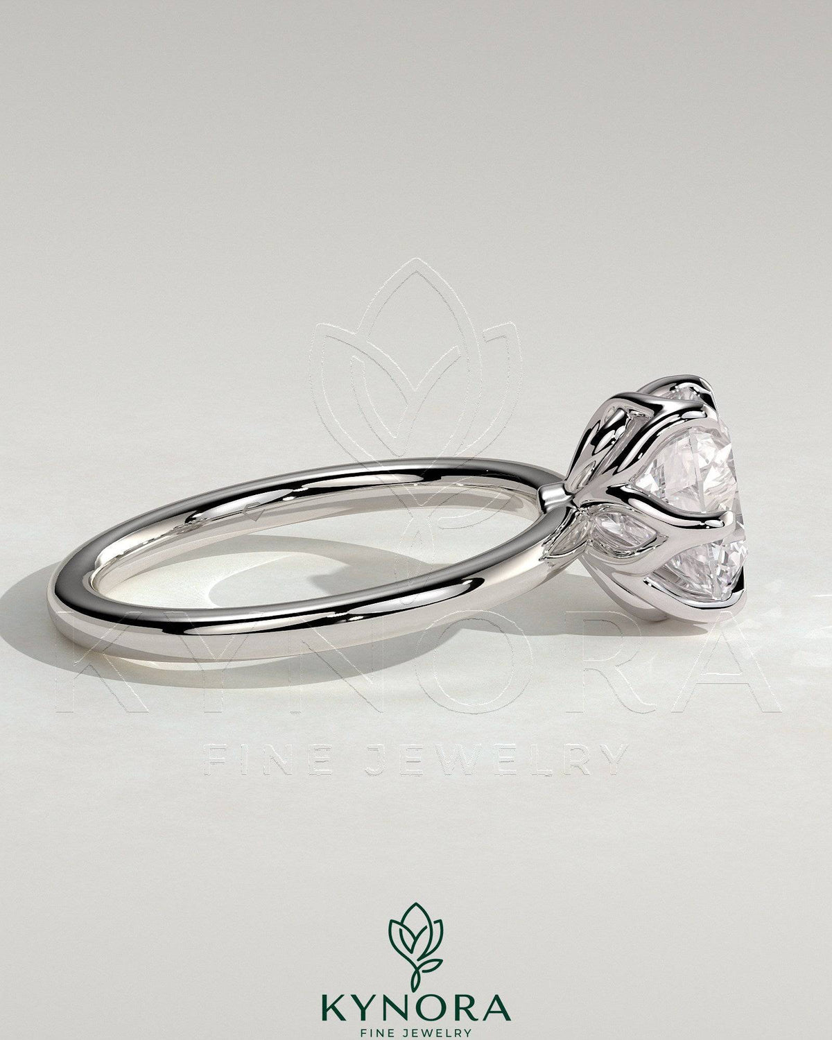 Kynora CJ 2ct round claw solitaire engagement ring with crossover petal gallery design, featuring a sparkling central diamond.