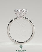 Kynora CJ 2ct round claw solitaire engagement ring with crossover petal gallery design, featuring a sparkling central diamond.