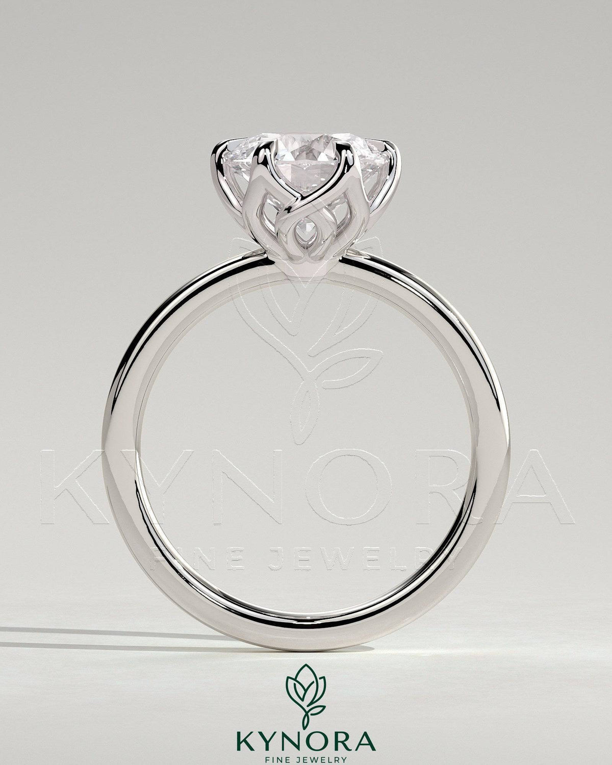 Kynora CJ 2ct round claw solitaire engagement ring with crossover petal gallery design, featuring a sparkling central diamond.