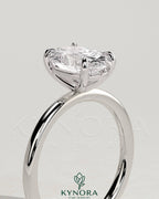 Kynora CJ Classic 2ct oval claw solitaire engagement ring with a central diamond set in a sleek platinum band.