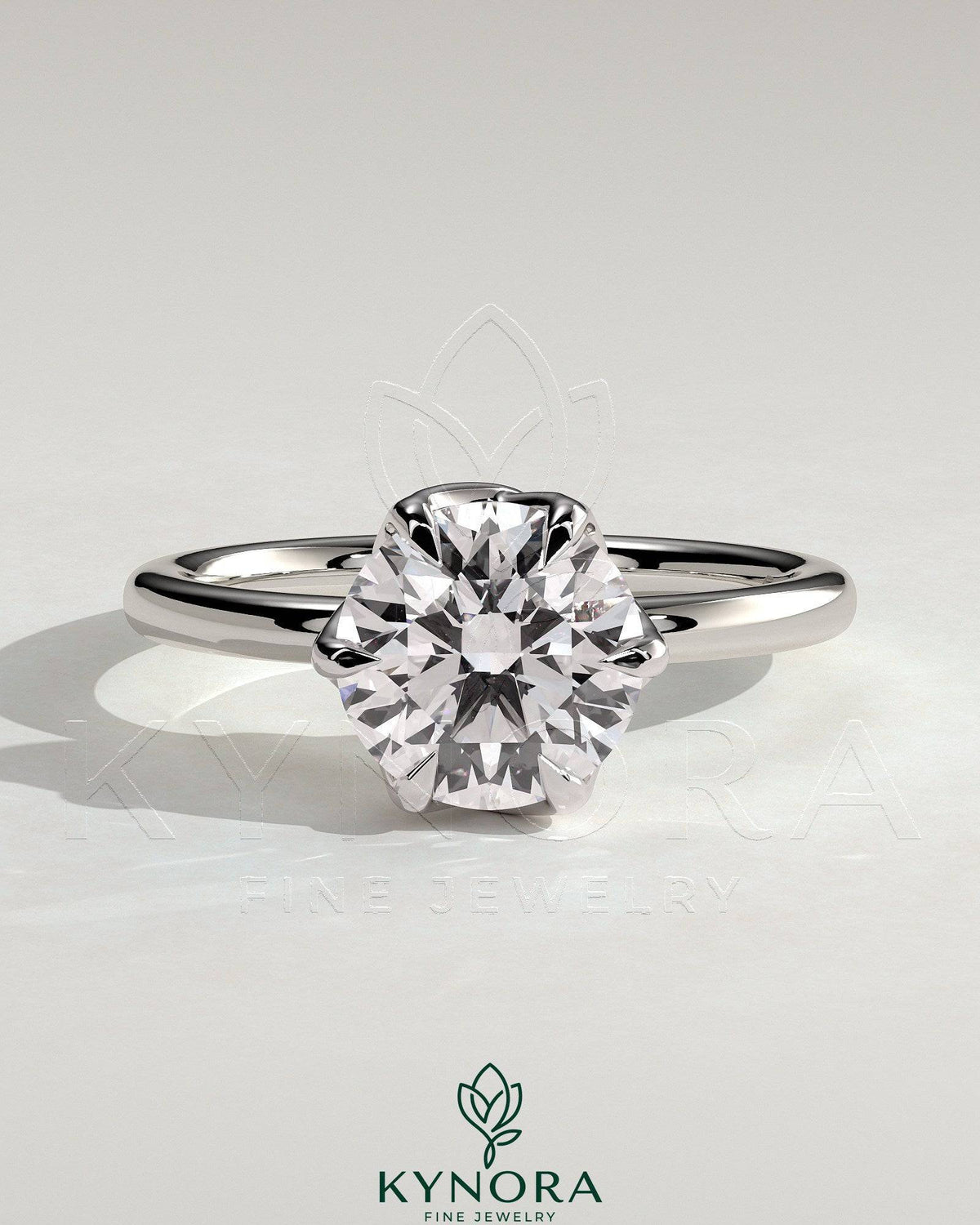 Kynora CJ 2ct round claw solitaire engagement ring with crossover petal gallery design, showcasing a sparkling center diamond. Imagen principal del producto