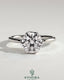 Kynora CJ 2ct round claw solitaire engagement ring with crossover petal gallery design, showcasing a sparkling center diamond.