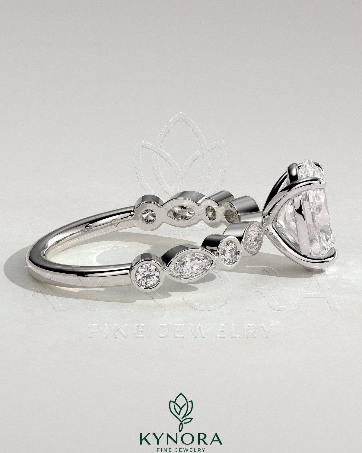Kynora CJ 2ct oval claw solitaire engagement ring with round marquise bezel accent stones, crafted in fine jewelry style.