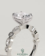 Kynora CJ 2ct oval claw solitaire engagement ring with round-marquise bezel accent stones, elegant and sparkling jewelry.