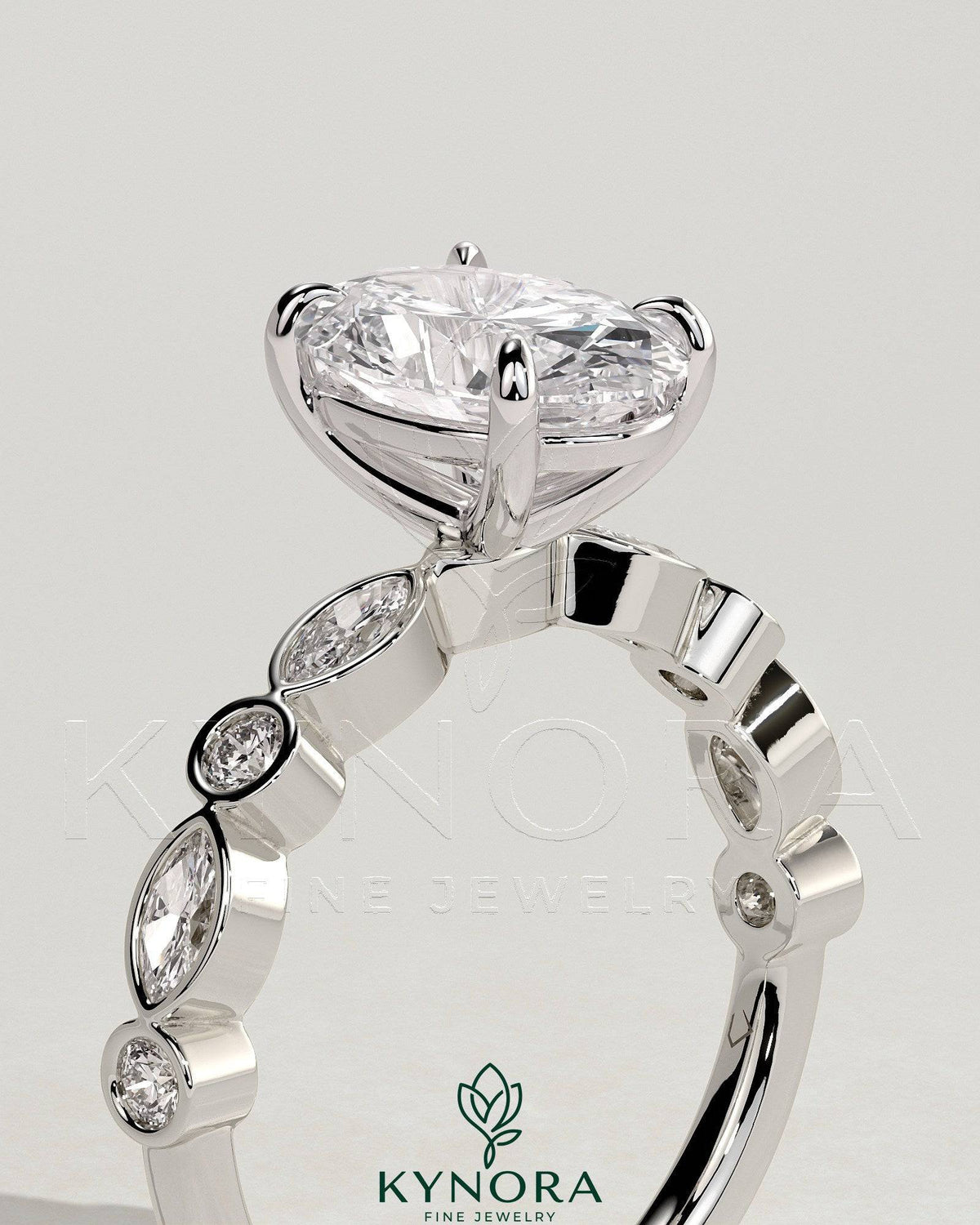 Kynora CJ 2ct oval claw solitaire engagement ring with round-marquise bezel accent stones, elegant and sparkling jewelry.