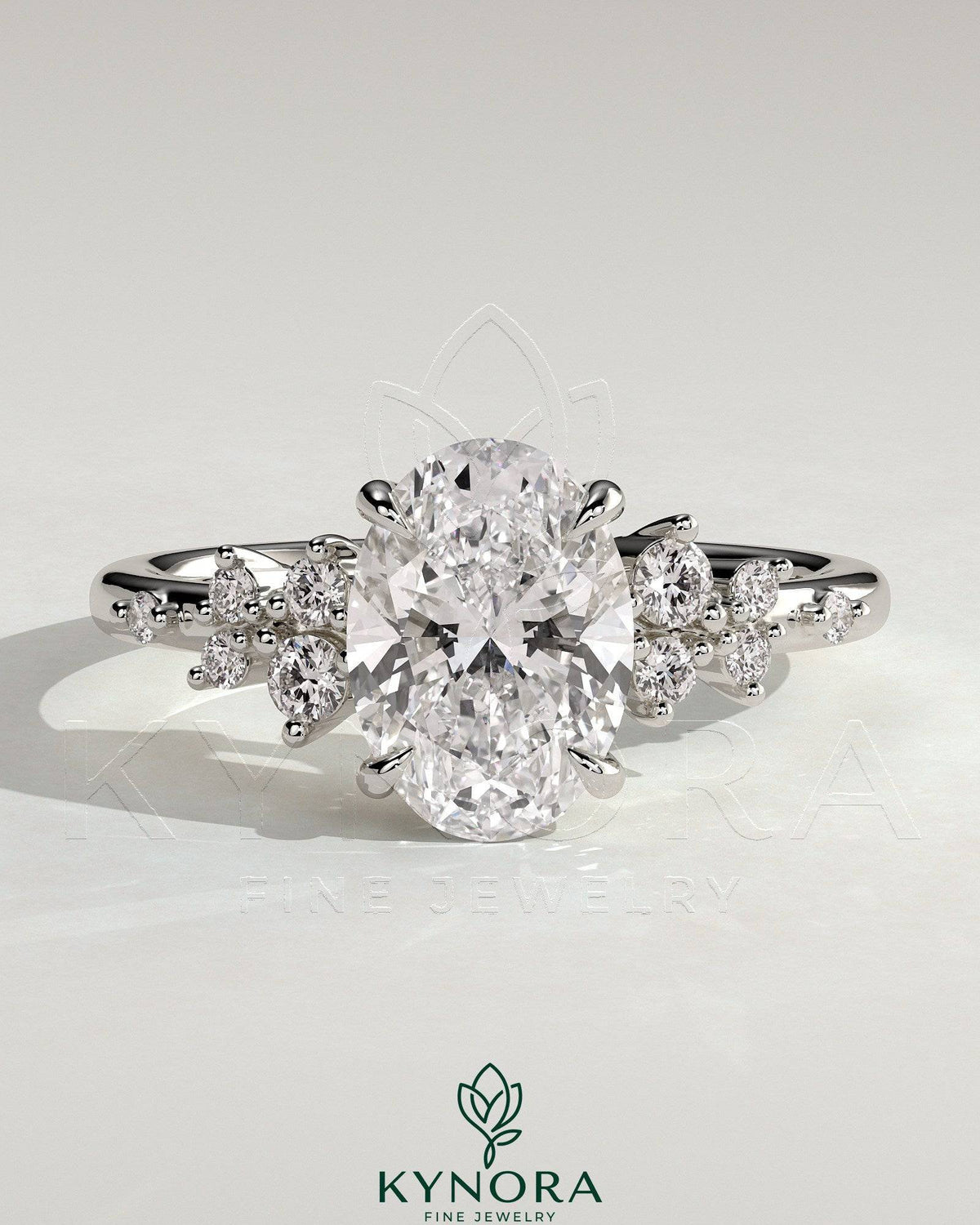 Kynora CJ 2ct oval claw solitaire engagement ring with clustered round shoulder stones, three-stone design, elegant and sparkling. Main image