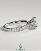 Kynora CJ 2ct round claw solitaire engagement ring with hidden halo, pave collar, and pave band showcasing sparkling diamond details.