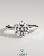 Kynora CJ 2ct round claw solitaire engagement ring with trellis gallery, lattice detail, and cathedral low setting.