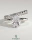 Kynora CJ 2ct pear-shaped diamond solitaire engagement ring with double plain and round accent stones on band.