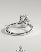 Kynora CJ 2ct oval claw solitaire engagement ring with hidden halo, showcasing a sparkling center diamond and elegant design.