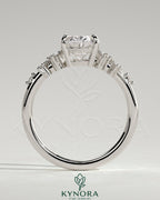 Kynora CJ 2ct oval claw solitaire engagement ring with three stones and clustered round shoulder stones, elegant jewelry design
