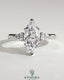 Kynora CJ 2ct marquise claw trilogy engagement ring with pear side stones and hidden halo, showcasing sparkling diamond design.
