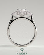 Kynora CJ 2ct marquise claw trilogy engagement ring with pear side stones and hidden halo, showcasing sparkling diamond details.