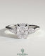 Kynora CJ 2ct elongated cushion cut trilogy engagement ring with pear side stones and cathedral setting, showcasing intricate details.