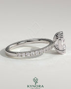 Kynora CJ 2ct elongated cushion cut solitaire engagement ring with triple claw setting and pave band, crafted in elegant jewelry design.