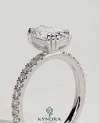 Kynora CJ 2ct elongated cushion triple claw solitaire engagement ring with pave band, showcasing a sparkling diamond and elegant design.