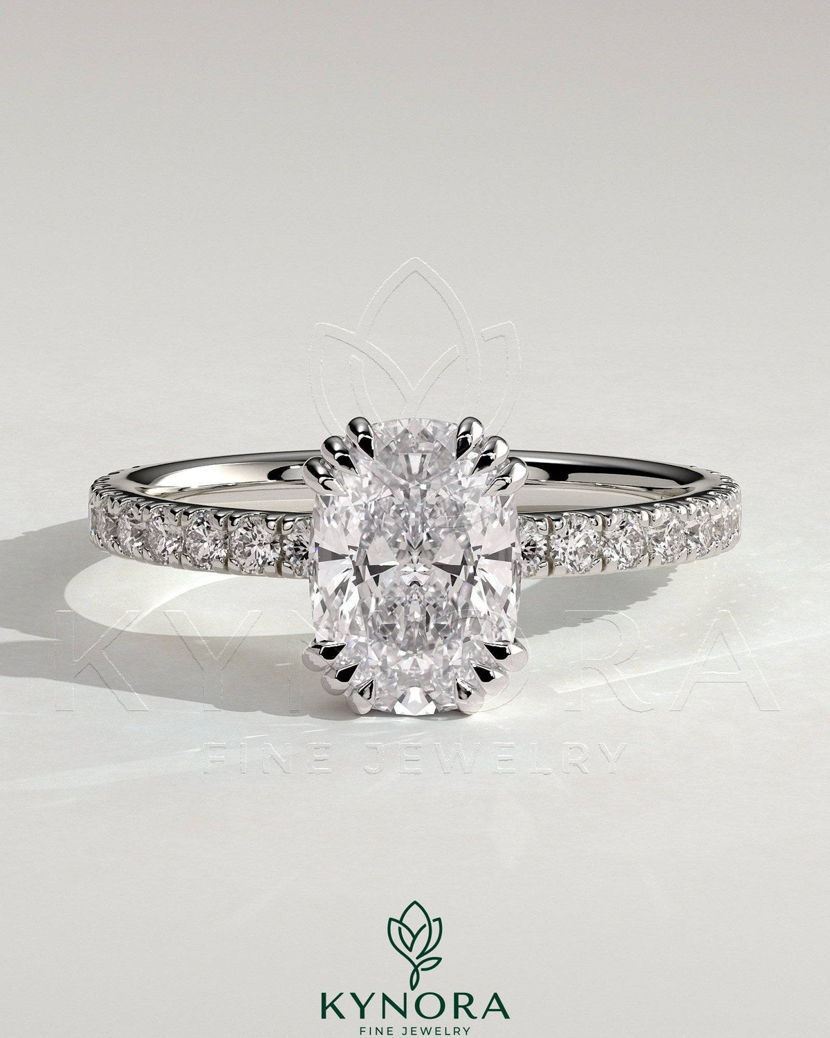 Kynora CJ 2ct elongated cushion triple claw solitaire engagement ring with pave band, featuring a central gemstone and elegant design. Main image