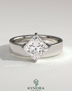 Kynora CJ 2ct Asscher cut solitaire engagement ring with offset setting and flat cigar band, showcasing elegant jewelry design.
