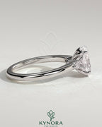 Kynora CJ 2ct oval claw trilogy engagement ring with pear side stones and tulip design in sterling silver.