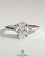 Kynora CJ 2ct oval claw trilogy engagement ring with pear side stones and tulip detail in elegant gold setting.