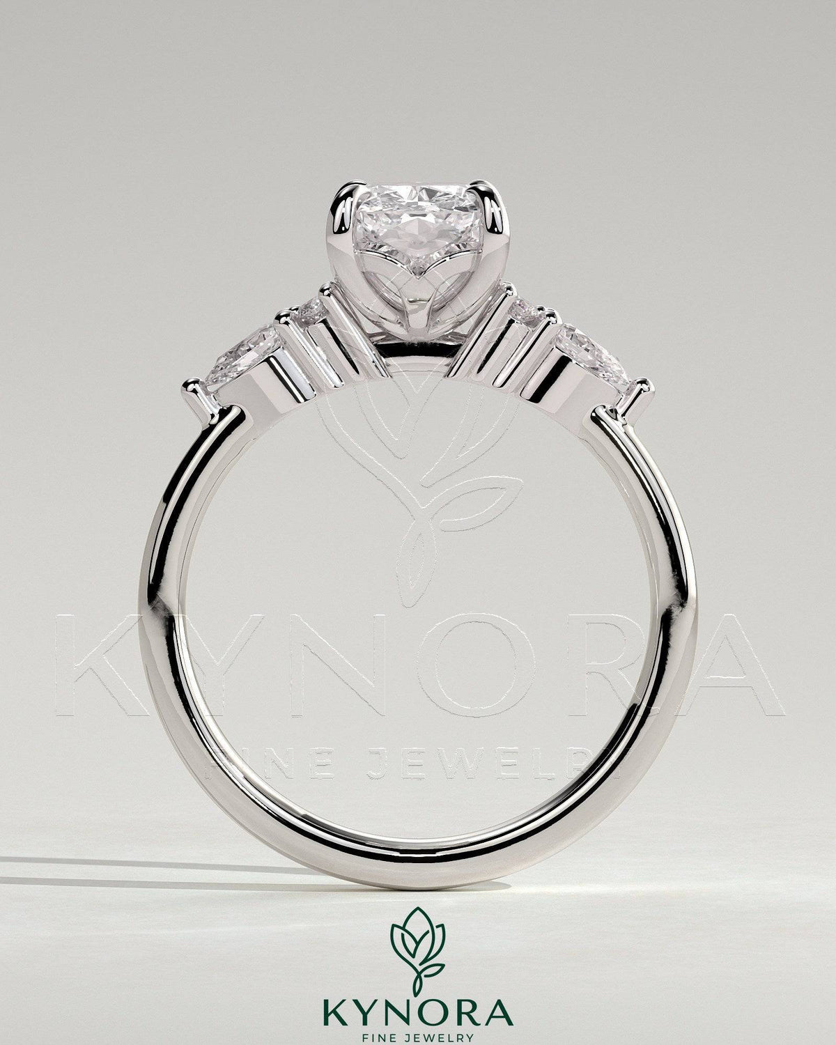 Kynora CJ 2ct elongated cushion claw solitaire engagement ring with pear accents and round shoulder stones in 14k gold