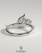 Kynora CJ 0.5ct and 1.25ct pear-shaped Toi et Moi engagement ring with claw settings featuring two pear-cut diamonds.
