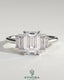 Kynora CJ 2ct emerald claw trilogy engagement ring with graduating baguette shoulder stones, three-stone diamond ring.