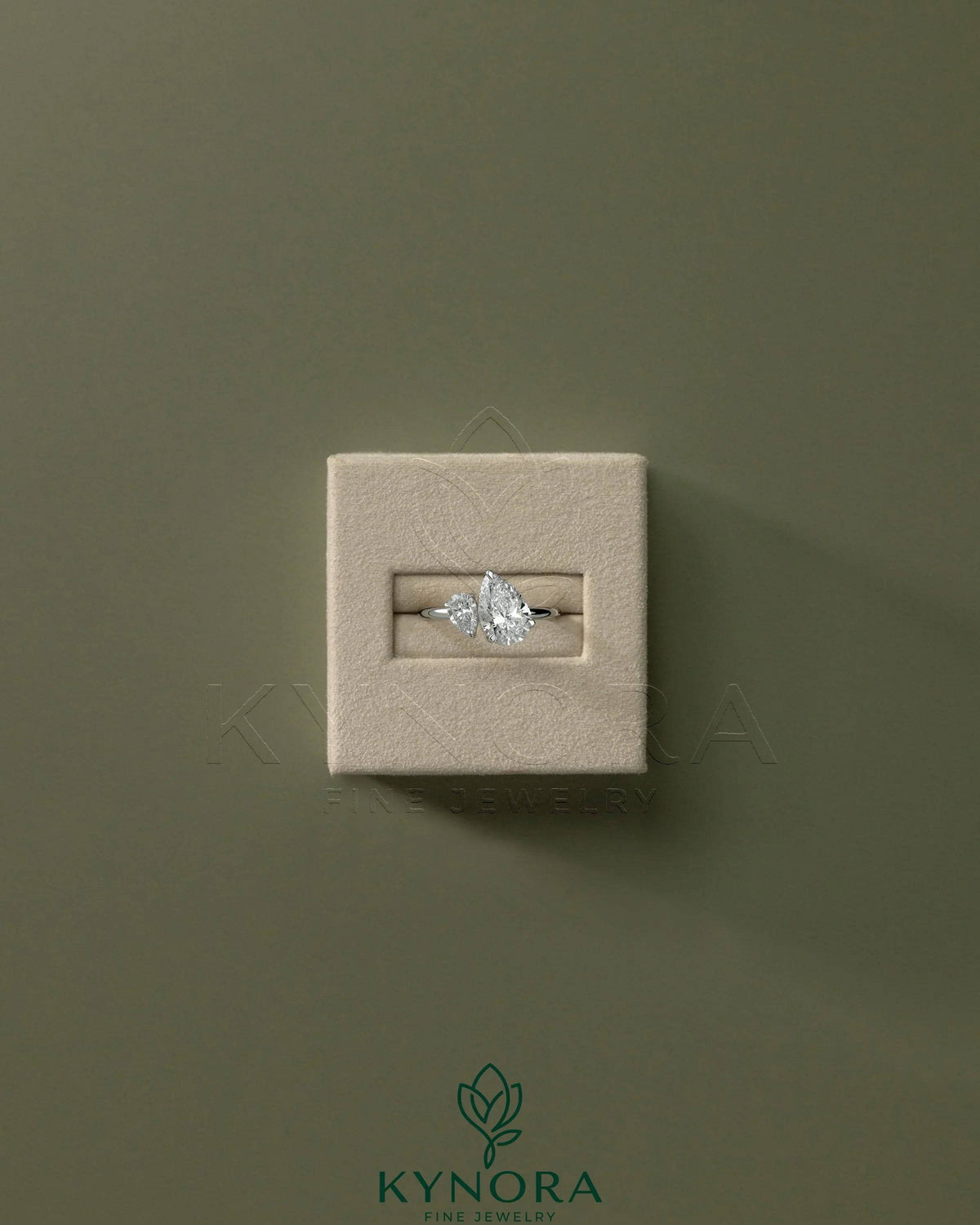 Kynora CJ 0.5ct pear-shaped and 1.25ct pear-shaped diamond Toi et Moi engagement ring with claw settings.
