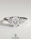 Kynora CJ 2ct elongated cushion claw trilogy engagement ring with round side stones and delicate lily detail in silver setting